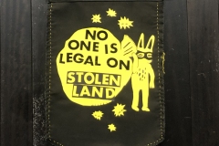No one is legal on stolen land banner